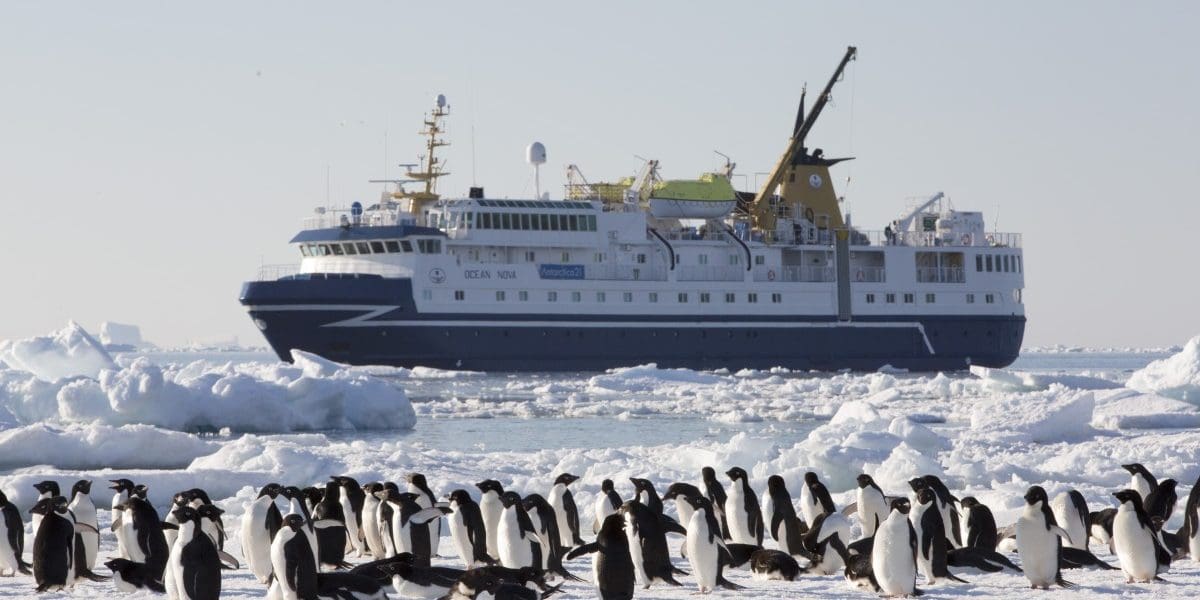 Northern Ireland Travel Magazine Antarctica21-ship-and-penguins-Courtesy-of-Antarctica21-1200x600 Apply to be Chief Flying Penguin Officer for Chance to Travel to Antarctica  