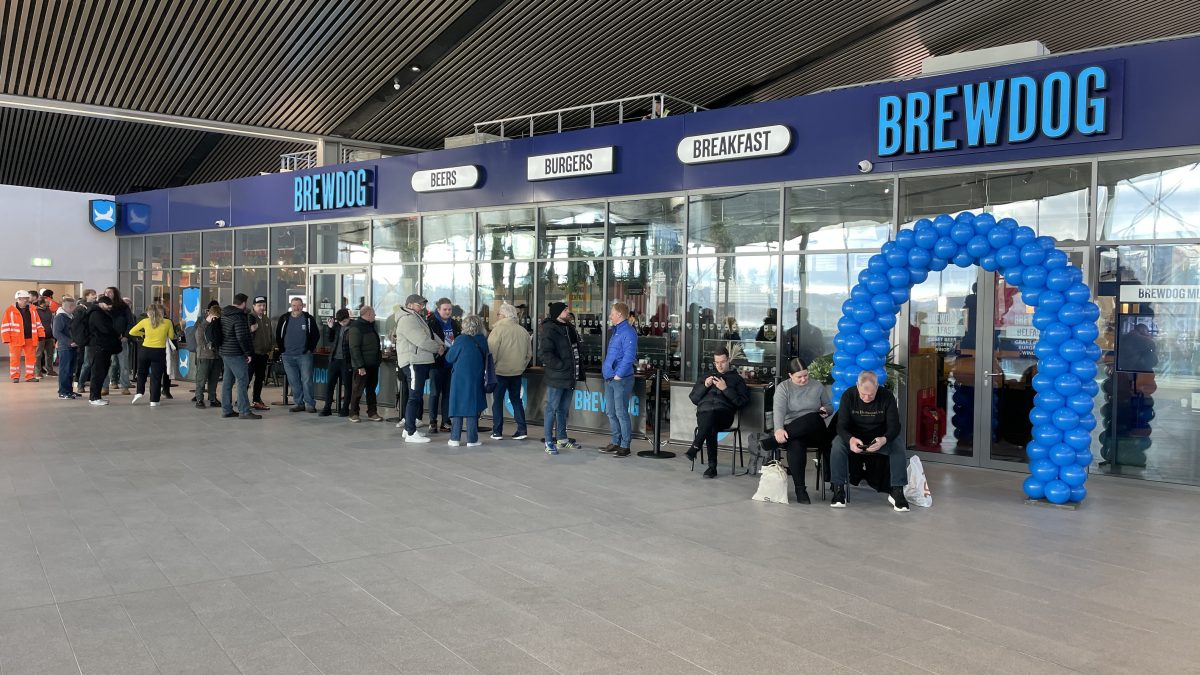 Beer fans waiting for the opening of BrewDog Belfast. picture of people waiting outside the new Belfast BrewDog