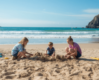 10 Best Things to Do with Children in Northern Ireland This Summer (July 2026) kids playing on a beach