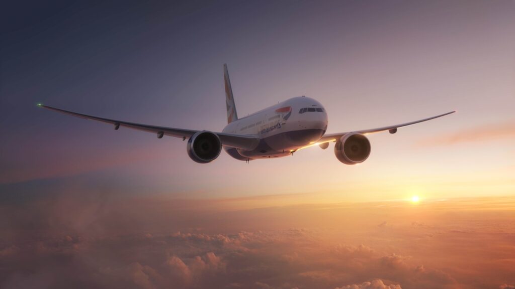 Airplane flying at sunset above clouds