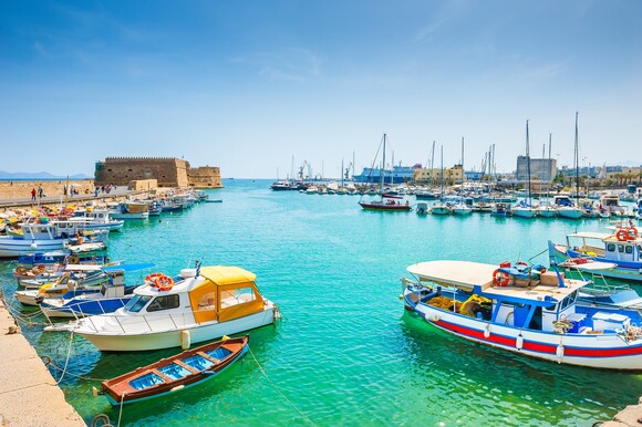 Boats moored in Heraklion old venetian port harbour in Crete.